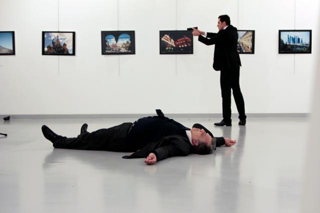 Russian Ambassador to Turkey Andrei Karlov lies on the ground after he was shot by Mevlut Mert Altintas at an art gallery in Ankara, Turkey, December 19, 2016. (REUTERS) Russian Ambassador to Turkey Andrei Karlov lies on the ground after he was shot by Mevlut Mert Altintas at an art gallery in Ankara, Turkey, December 19, 2016. (REUTERS)