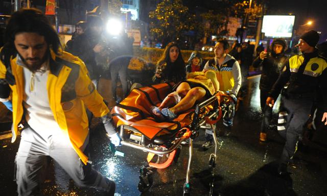First aid officers carry an injured woman at the site of an armed attack in Istanbul. (AFP Photo) First aid officers carry an injured woman at the site of an armed attack in Istanbul. (AFP Photo)