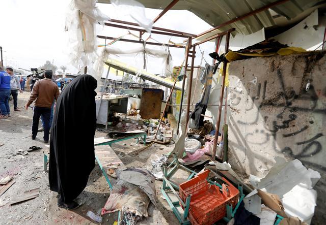 A woman reacts at the site of car bomb attack in a busy square in Baghdad's sprawling Sadr City district. (Reuters Photo) A woman reacts at the site of car bomb attack in a busy square in Baghdad's sprawling Sadr City district. (Reuters Photo)