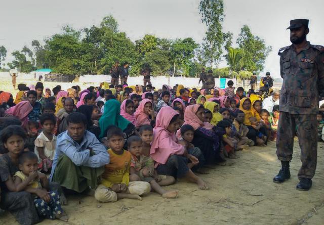 Rohingya Muslims from Myanmar, who tried to cross the Naf river into Bangladesh to escape sectarian violence, kept under watch by Bangladeshi security officials in Teknaf. (AFP file photo) Rohingya Muslims from Myanmar, who tried to cross the Naf river into Bangladesh to escape sectarian violence, kept under watch by Bangladeshi security officials in Teknaf. (AFP file photo)