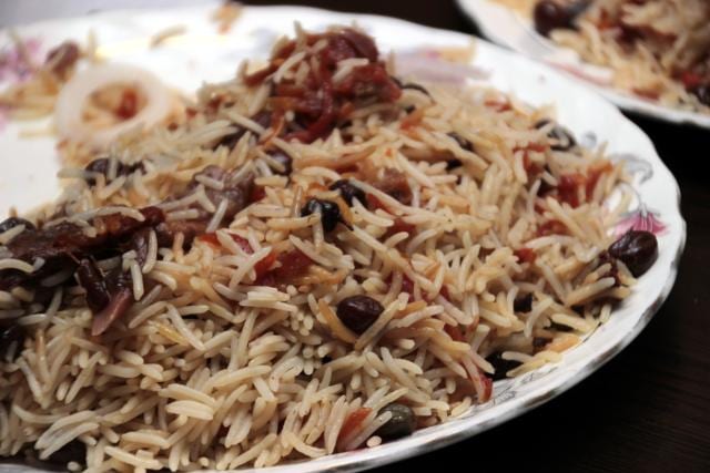 Kabuli Pulao, Afghanistan’s national dish, is prepared with steamed rice and mixed with raisins, carrots and lamb. (Shivam Saxena/ HT Photo)