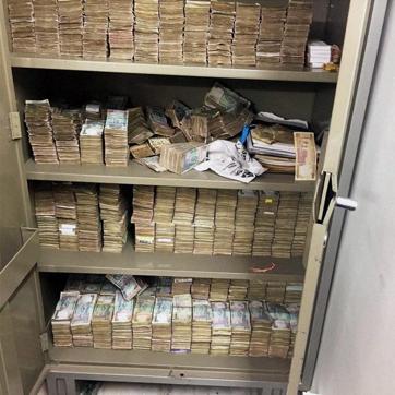 Stacks of currency notes that was found at Rohit Tandon's Greater Kailash residence during a raid by Delhi Police crime branch. Cash worth Rs 13.65 cr, including at least Rs 2.61 cr in new Rs 2,000 currency notes were recovered. (PTI file photo) Stacks of currency notes that was found at Rohit Tandon's Greater Kailash residence during a raid by Delhi Police crime branch. Cash worth Rs 13.65 cr, including at least Rs 2.61 cr in new Rs 2,000 currency notes were recovered. (PTI file photo)