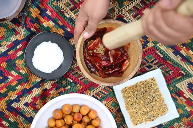 Grinding spices to make a baer (berry) pickle (Photo courtesy: Kunal Kapur )