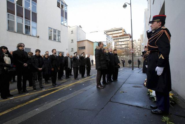 District mayor Francois Vauglin, Paris mayor Anne Hidalgo, French interior minister Bruno Leroux and state secretary in charge of victims Juliette Meadel stand at attention at the place of the attacks of Charlie Hebdo to mark the second anniversary of the attack on Thursday. (AP) District mayor Francois Vauglin, Paris mayor Anne Hidalgo, French interior minister Bruno Leroux and state secretary in charge of victims Juliette Meadel stand at attention at the place of the attacks of Charlie Hebdo to mark the second anniversary of the attack on Thursday. (AP)