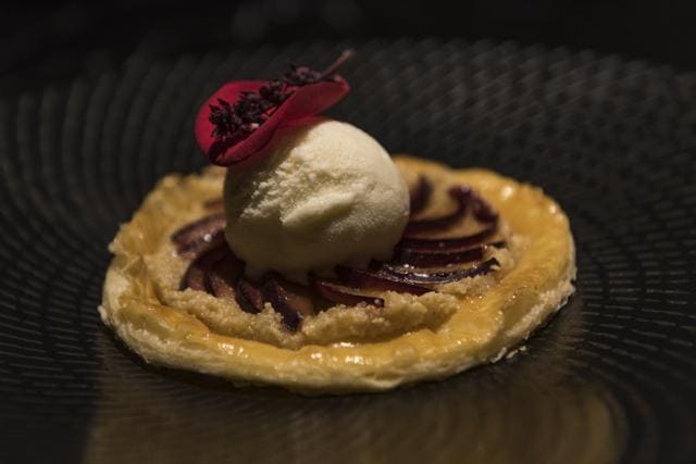 The plum and frangipane tart with house-churned vanilla ice cream was flaky and sweet and overall looked and sounded better than it taste. (Aalok Soni / HT Photo )