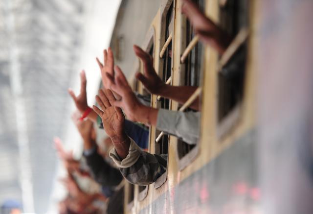 Indian fishermen wave from the train at the railway station in Karachi after their release from prison. (AFP Photo) Indian fishermen wave from the train at the railway station in Karachi after their release from prison. (AFP Photo)