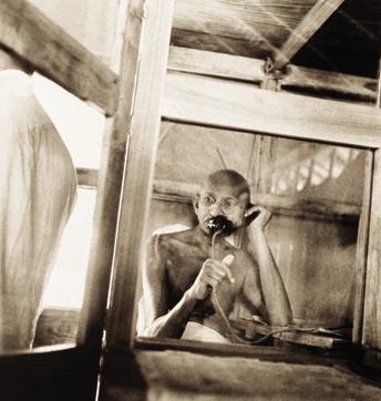 Sevagram Ashram, 1938: Mahatma Gandhi telephoning from the office hut. (Photo courtesy: Kanu Gandhi/©The Estate of Kanu Gandhi) Sevagram Ashram, 1938: Mahatma Gandhi telephoning from the office hut. (Photo courtesy: Kanu Gandhi/©The Estate of Kanu Gandhi)