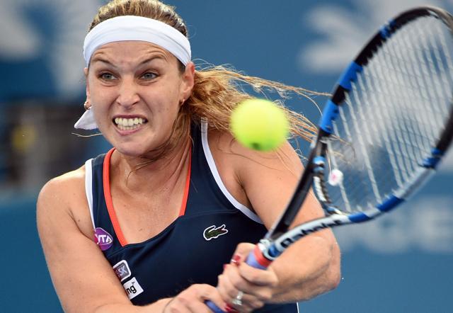 Dominika Cibulkova of Slovakia hits a return against Alize Cornet of France. (AFP)