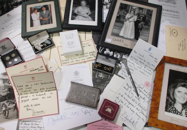 An undated handout picture released by Cheffins auctioneers, received in London on January 5, 2017, shows a selection of correspondence and memorabilia sent, and given to, Cyril Dickman, during his time as butler at the Royal Household. Letters handwritten by the late Princess Diana, including one describing how son Prince Harry was "constantly in trouble", sold for nearly £15,000 ($18,600, 17,500 euros) at a London auction on Thursday. (AFP Photo)