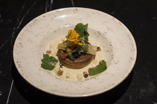 The double-baked goat cheese soufflé with braised leek confit and cranberry pickle lacked the tanginess of goat cheese. (Aalok Soni / HT Photo )