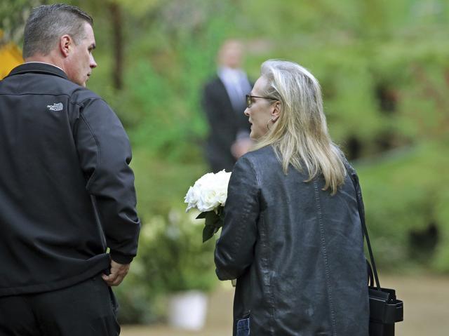 Actress Meryl Streep arrives with flowers. (AP)