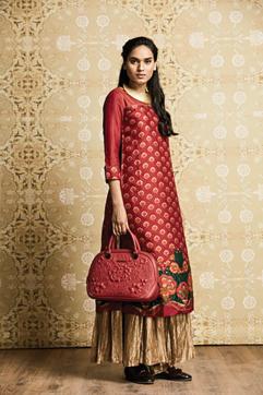Veteran designer Ritu Kumar’s long crimson kurta can be teamed with varied bottoms for conjuring different looks Veteran designer Ritu Kumar’s long crimson kurta can be teamed with varied bottoms for conjuring different looks