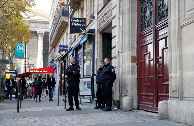 This file photo taken at the Rue Tronchet, near Madeleine, central Paris, on October 3, 2016 shows police officers standing guard at the entrance of the hotel residence, where US reality television star Kim Kardashian was robbed at gunpoint by assailants disguised as police who made off with millions, mainly in jewellery. (AFP Photo) This file photo taken at the Rue Tronchet, near Madeleine, central Paris, on October 3, 2016 shows police officers standing guard at the entrance of the hotel residence, where US reality television star Kim Kardashian was robbed at gunpoint by assailants disguised as police who made off with millions, mainly in jewellery. (AFP Photo)