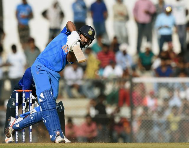 India A batsman Yuvraj Singh plays a shot during the first warm-up one day cricket match between India A and England XI at the Cricket Club of India (CCI) stadium. (AFP) India A batsman Yuvraj Singh plays a shot during the first warm-up one day cricket match between India A and England XI at the Cricket Club of India (CCI) stadium. (AFP)