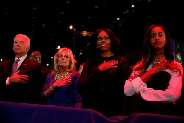 US vice-president Joe Biden, his wife Jill Biden, First Lady Michelle Obama and her daughter Malia Obama stand for the national anthem before President Barack Obama delivers his farewell address in Chicago. (Reuters Photo) US vice-president Joe Biden, his wife Jill Biden, First Lady Michelle Obama and her daughter Malia Obama stand for the national anthem before President Barack Obama delivers his farewell address in Chicago. (Reuters Photo)