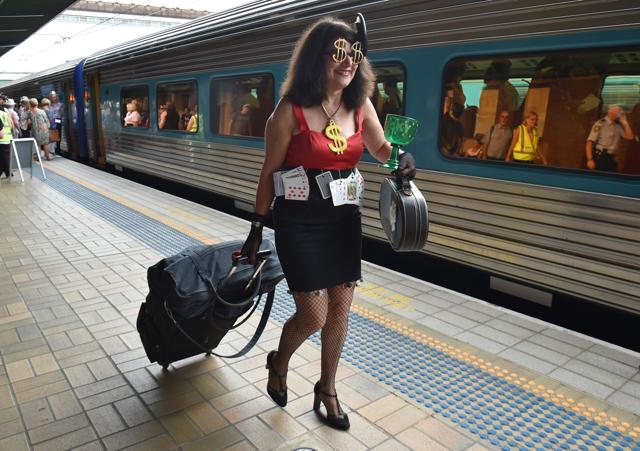 A female Elvis fan boards a train from Sydney to attend The Parkes Elvis Festival, an annual event held to celebrate the music and life of Elvis Presley. (AFP Photo) A female Elvis fan boards a train from Sydney to attend The Parkes Elvis Festival, an annual event held to celebrate the music and life of Elvis Presley. (AFP Photo)
