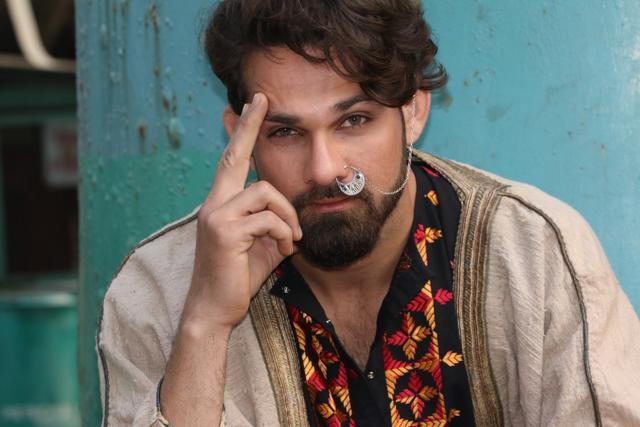 This look is for courageous guys who love turning fashion rules on their heads. Androgyny being the new black, gender neutral jewellery is in trend. Add some rustic swag to your look with a silver nath. Nothing like it if you can pair it with a groomed beard, the way model Anurag Fageriya does it. (Shara Ashraf/ HT Photo )