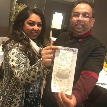 Restaurant director Luna Ekuch and chef Babu display the bill with a tip of £1,000 left by a loyal customer last week. (Facebook) Restaurant director Luna Ekuch and chef Babu display the bill with a tip of £1,000 left by a loyal customer last week. (Facebook)