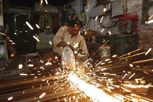 An employee works inside a metal workshop in Kolkata. Although Rs 12 lakh crore has fattened the banking system, a lending bonanza to companies could be dampened by an overhang of bad loans and slowing demand, now made slower by demonetisation. (Reuters Photo) An employee works inside a metal workshop in Kolkata. Although Rs 12 lakh crore has fattened the banking system, a lending bonanza to companies could be dampened by an overhang of bad loans and slowing demand, now made slower by demonetisation. (Reuters Photo)