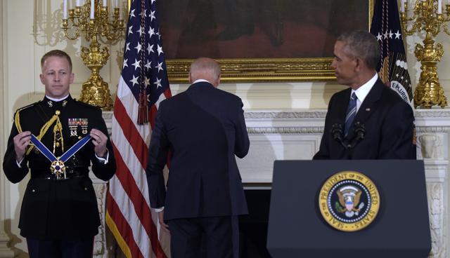 Vice-president Joe Biden turns away as he wipes away tears after President Barack Obama surprised him during a ceremony in the State Dining Room of the White House in Washington. (AP Photo) Vice-president Joe Biden turns away as he wipes away tears after President Barack Obama surprised him during a ceremony in the State Dining Room of the White House in Washington. (AP Photo)