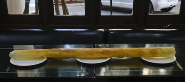 Customers love to take selfies with the 3-ft-long paper dosa at Dakshinayan. (Aalok Soni/HT PHOTO)