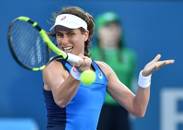 Johanna Konta of Britain hits a return to Agnieszka Radwanska of Poland in their women's singles final match at the Sydney International tennis tournament. (AFP)
