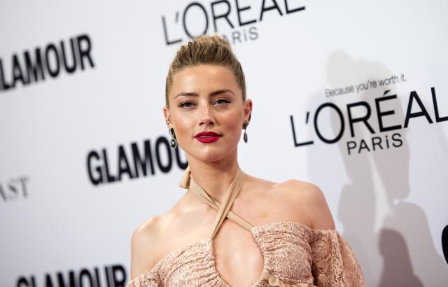 Amber Heard has decided to split her $7 million divorce settlement equally between the American Civil Liberties Union and the Children’s Hospital of Los Angeles. (AFP) Amber Heard has decided to split her $7 million divorce settlement equally between the American Civil Liberties Union and the Children’s Hospital of Los Angeles. (AFP)