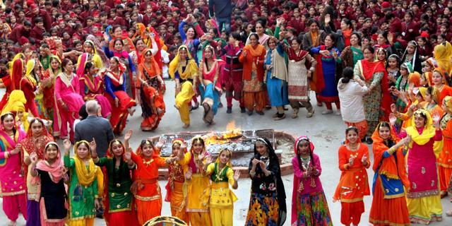 Students dance during the Lohri celebration at a School in Patiala. (PTI) Students dance during the Lohri celebration at a School in Patiala. (PTI)