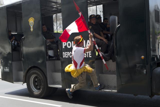 A small group of anti-globalisation activists shouting "Get Out Obama" and "TPP kills" protest during the APEC summit. (AP Photo) A small group of anti-globalisation activists shouting "Get Out Obama" and "TPP kills" protest during the APEC summit. (AP Photo)