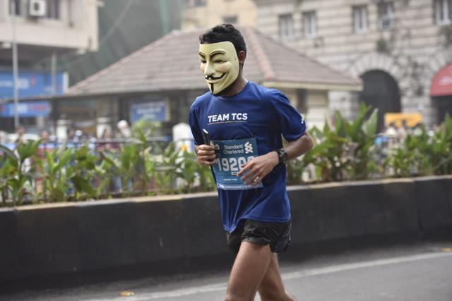 Athlete in a Guy Fawkes mask runs during the full marathon in Mumbai. (Arijit Sen/HT Photo) Athlete in a Guy Fawkes mask runs during the full marathon in Mumbai. (Arijit Sen/HT Photo)