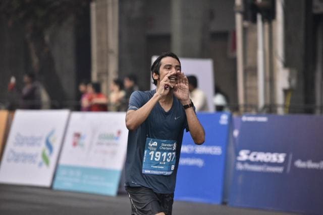 Athlete makes a signal while running during the full marathon in Mumbai. (Arijit Sen/HT Photo) Athlete makes a signal while running during the full marathon in Mumbai. (Arijit Sen/HT Photo)