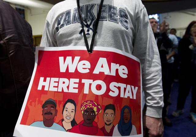 Immigrant rights advocates demonstrate against President-elect Donald Trump's immigration policies, during a rally at Metropolitan AME Church in Washington on Saturday (AP) Immigrant rights advocates demonstrate against President-elect Donald Trump's immigration policies, during a rally at Metropolitan AME Church in Washington on Saturday (AP)