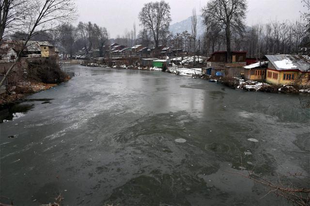 A view of the frozen Dal Lake in Srinagar, where night temperature dropped to minus 6.8 degree Celsius on Saturday. The Kashmir valley has been experiencing intense cold conditions after widespread snowfall last week. (PTI) A view of the frozen Dal Lake in Srinagar, where night temperature dropped to minus 6.8 degree Celsius on Saturday. The Kashmir valley has been experiencing intense cold conditions after widespread snowfall last week. (PTI)