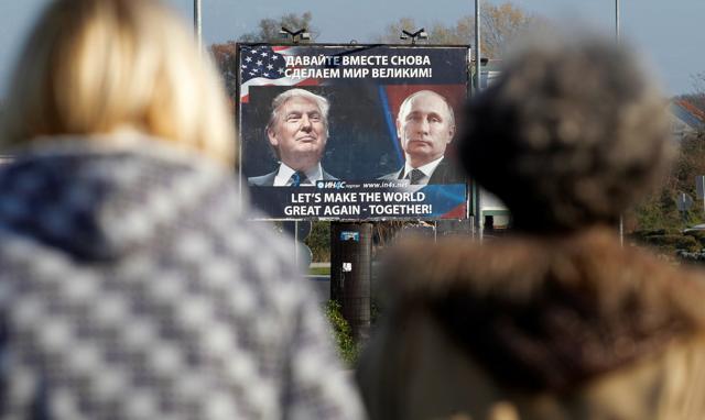 A billboard showing a pictures of US president-elect Donald Trump and Russian President Vladimir Putin is seen through pedestrians in Danilovgrad, Montenegro on November 16, 2016. (Reuters file photo) A billboard showing a pictures of US president-elect Donald Trump and Russian President Vladimir Putin is seen through pedestrians in Danilovgrad, Montenegro on November 16, 2016. (Reuters file photo)