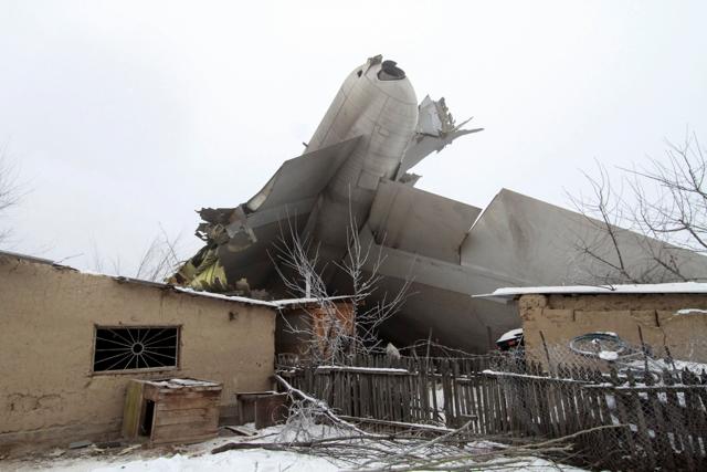 Plane debris which crashed into residential area near Kyrgyzstan’s Manas airport outside Bishkek. (REUTERS) Plane debris which crashed into residential area near Kyrgyzstan’s Manas airport outside Bishkek. (REUTERS)