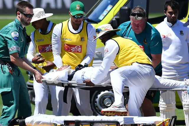 Mushfiqur Rahim lifted onto a stretcher by ambulance staff and teammates after being hit in the head during day five of the first Test between New Zealand and Bangladesh at the Basin Reserve in Wellington on Monday. (AFP) Mushfiqur Rahim lifted onto a stretcher by ambulance staff and teammates after being hit in the head during day five of the first Test between New Zealand and Bangladesh at the Basin Reserve in Wellington on Monday. (AFP)