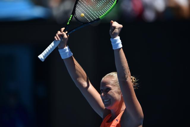 Shelby Rogers of the US celebrates her victory against Romania's Simona Halep during their women's singles match on day one of the Australian Open tennis tournament in Melbourne on Monday. (AFP) Shelby Rogers of the US celebrates her victory against Romania's Simona Halep during their women's singles match on day one of the Australian Open tennis tournament in Melbourne on Monday. (AFP)