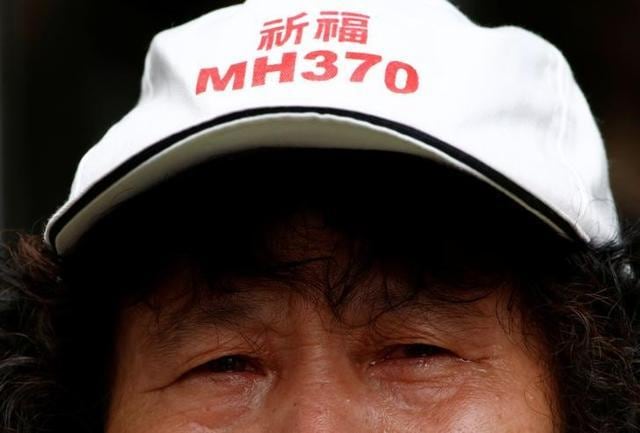 A family member of a passenger aboard Malaysia Airlines flight MH370 reacts during a protest outside the Chinese foreign ministry in Beijing. (Reuters File Photo) A family member of a passenger aboard Malaysia Airlines flight MH370 reacts during a protest outside the Chinese foreign ministry in Beijing. (Reuters File Photo)