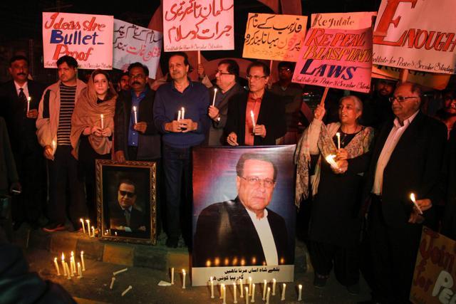 Members of the Institute for Peace and Secular Studies gather around portraits of assassinated provincial governor Salman Taseer in Lahore, during a ceremony marking his death anniversary. Pakistan police arrested 160 people on January 4, 2017 at a rally to celebrate the assassination of a liberal provincial governor who called for the country's tough blasphemy laws to be reformed. (AFP File Photo) Members of the Institute for Peace and Secular Studies gather around portraits of assassinated provincial governor Salman Taseer in Lahore, during a ceremony marking his death anniversary. Pakistan police arrested 160 people on January 4, 2017 at a rally to celebrate the assassination of a liberal provincial governor who called for the country's tough blasphemy laws to be reformed. (AFP File Photo)