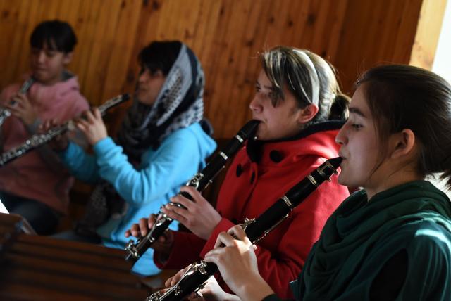 Afghan girls of the first female orchestra playing flutes. (AFP Photo) Afghan girls of the first female orchestra playing flutes. (AFP Photo)