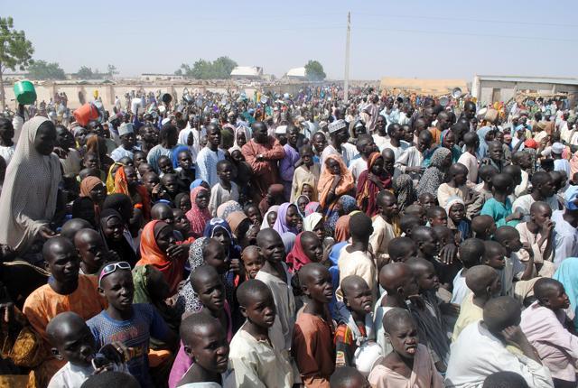 This shows Internally Displaced Persons (IDP) mostly women and children standing, waiting for food at Dikwa Camp, in Borno State in north-eastern Nigeria. It was believed to be the first time Nigeria’s military has acknowledged making such a mistake in a region where villagers have in the past reported civilian casualties in the near-daily bombings targeting the Islamic militants. (File photo/ AFP Photo) This shows Internally Displaced Persons (IDP) mostly women and children standing, waiting for food at Dikwa Camp, in Borno State in north-eastern Nigeria. It was believed to be the first time Nigeria’s military has acknowledged making such a mistake in a region where villagers have in the past reported civilian casualties in the near-daily bombings targeting the Islamic militants. (File photo/ AFP Photo)
