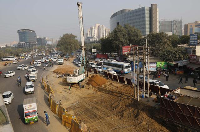 On an average, 15,000 vehicles pass through the Iffco Chowk every hour and it is to address this volume of traffic that an underpass project is being built at the junction. (Sanchit Khanna/HT Photo) On an average, 15,000 vehicles pass through the Iffco Chowk every hour and it is to address this volume of traffic that an underpass project is being built at the junction. (Sanchit Khanna/HT Photo)