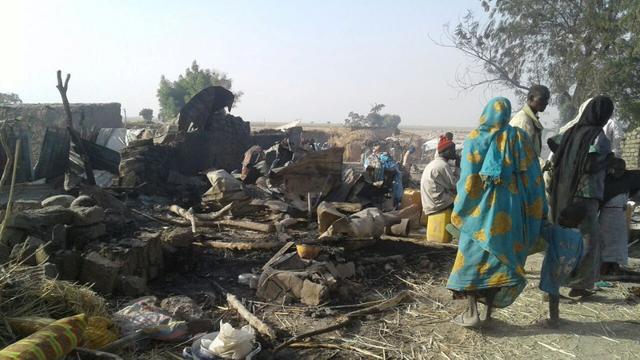 People walk at the site after a bombing attack of an internally displaced persons camp in Rann, Nigeria. Nigeria’s President Muhammadu Buhari expressed deep sadness and regret at “this regrettable operational mistake”. (MSF/Handout via Reuters) People walk at the site after a bombing attack of an internally displaced persons camp in Rann, Nigeria. Nigeria’s President Muhammadu Buhari expressed deep sadness and regret at “this regrettable operational mistake”. (MSF/Handout via Reuters)