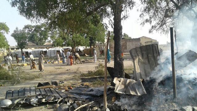 People walk at the site after a bombing attack of an internally displaced persons camp in Rann, Nigeria January 17, 2017. (REUTERS Photo) People walk at the site after a bombing attack of an internally displaced persons camp in Rann, Nigeria January 17, 2017. (REUTERS Photo)