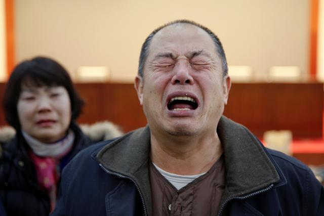 Wen Wancheng, whose son was among passengers onboard Malaysia Airlines flight MH370 which went missing in 2014, cries as relatives arrive for a meeting with the airline representatives in Beijing, China January 18, 2017. (REUTERS) Wen Wancheng, whose son was among passengers onboard Malaysia Airlines flight MH370 which went missing in 2014, cries as relatives arrive for a meeting with the airline representatives in Beijing, China January 18, 2017. (REUTERS)