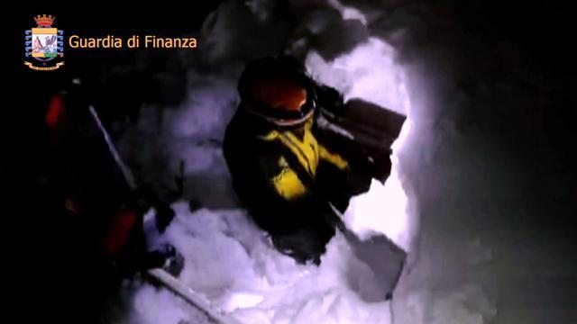 This image grab made from a video handout released by the Guardia di Finanza shows a rescue team member digging the snow at the Hotel Rigopiano. (AFP) This image grab made from a video handout released by the Guardia di Finanza shows a rescue team member digging the snow at the Hotel Rigopiano. (AFP)
