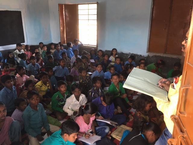 Schoolchildren take their classes on floor at a government upgraded middle school in Parsauni Kapoor in West Champaran district of Bihar. (Arun Kumar/HT file photo)