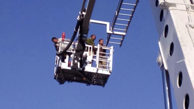 The fire department also used hydraulic platforms and ropes to rescue labourers. (HT Photo) The fire department also used hydraulic platforms and ropes to rescue labourers. (HT Photo)
