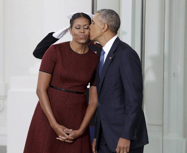 President Barack Obama kisses first lady Michelle Obama as they await for the arrival of President-elect Donald Trump and his wife Melania. (AP) President Barack Obama kisses first lady Michelle Obama as they await for the arrival of President-elect Donald Trump and his wife Melania. (AP)