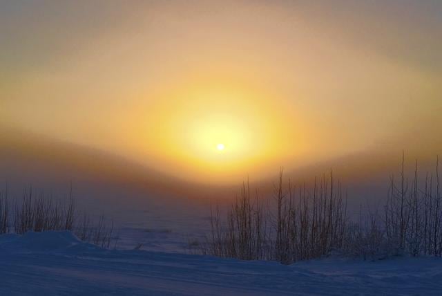 The sun rises through ice fog on the Yukon River, in Tanana, Alaska. (AP Photo) The sun rises through ice fog on the Yukon River, in Tanana, Alaska. (AP Photo)